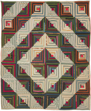 It features a variation of the classic log cabin design in 42 squares. The concentric squares are broken up by a highly contrasting concentric diamond over the top. A very striking composition with great visual power. Would be very impactful hung on a wall. Quilt