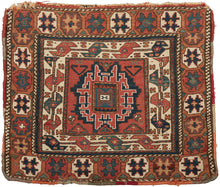 This Soumak bag was handwoven by the Shahsavan during the late 19th century.  It features a central leshgi star surrounded by an inner ivory border of serpentine sawtooth "S"s and an outer border of octagons filled with eight pointed stars. This bag was utilized by nomads for carrying goods. The backing is a pattern of thick alternating red and purple stripes A great wall or learning piece!