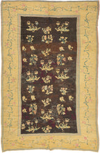  bunches of grapes, leaves and various floral forms on an open brown/black ground.  blossoming vines that meander around the perimeter on a canary yellow ground. It is woven in a curvilinear style that utilizes so-called "eccentric wefts" associated with weaving from Kiev and the regions further east. Hali magazine has published Ukrainian Decorative Folk Art Museum. The combination of eccentric wefts, coloration and the subject of grapes help attribute this example to Kiev or nearby Chernihiv. palimpsest