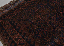 Afghan Baluch lattice design in blue, dusty pink and mauve pink. Plush silky wool with a very dark but lustrous complexion. Framed by an alternating "S" with contrasting sawtooth borders and finished with multiple bands of detailed weft float kilim. Originally intended to be used as a bag, remnants of the goat hair enclosures still survive. 