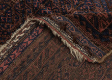 Afghan Baluch lattice design in blue, dusty pink and mauve pink. Plush silky wool with a very dark but lustrous complexion. Framed by an alternating "S" with contrasting sawtooth borders and finished with multiple bands of detailed weft float kilim. Originally intended to be used as a bag, remnants of the goat hair enclosures still survive. 