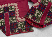 These trouser cuffs were handmade in Turkmenistan during the 20th Century.&nbsp;  Turkmen women traditionally wear colorful ankle length dresses with baggy trousers in contrasting color and decorated bands. These trousers feature wonderful detailed embroidery bands near the ankles in blue, red, green and ivory on a magenta cloth.