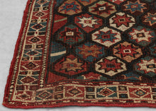 It is woven in soumak weave and features a lattice of polychrome polygons filled with eight pointed stars. The color palette red, blue, yellows, brown and green with bright whites woven in cotton. The whole is framed by a border of diamond filled cartouches.&nbsp;