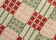 Overshot American Coverlet a grid of squares that utilize red and green wefts over an exposed white warp to create various patterns including stripes, diamonds and snowflakes. The grid is surrounded by a border of thin patterning on three sides. The top unbordered section is seamed with cloth indicating the original coverlet was likely longer.The addition of borders showcase the weaver's proficiency and skill. Fine weaving and wonderful contrast give this a crisp feel and eye dazzling visual effect.