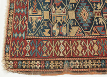 This rug was woven during the 19th century in Kuba district of the Northern Caucasus

It features an allover geometric lattice design against an indigo backdrop. A nicely spaced red ground main border provides the perfect contrast to the field. Four stylized animal figures can be seen near the bottom of the field.