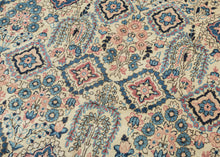 This Sarouk was handwoven during the middle of the 20th century.

The composition is composed of various weeping willows and floral bouquets in a pleasing palette of blues, reds and pinks on a pale yellow ground. This patterning is uncharacteristic of Sarouk weaving and more commonly associated with Kashan. Nicely framed by a distinctive red and yellow dual ground interlock border.