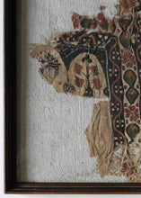 This Coptic textile was woven in Egypt or the Levant during the 5th-7th century AD.&nbsp;

This colorful pieces features a fragment that includes various part of a tree or floral motif as well as multiple borders including matching minor borders of flowering vines and a main border of rosettes and leaves. Very finely woven with crisp rendering and nice contrast.