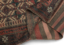 BALUCH BALISHT It features a geometric trellis motif in a variety of earthy reds and deep greens on a camel ground. The Baluch are masters of accomplishing a lot with a limited palette most often with the strategic use of white as us seen in the borders. This balisht has it's original kilim back still intact and which employs thick stripes of reds, blues, brown and purple.