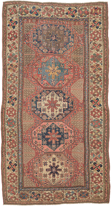 This Shahsavan rug was during the 19th century.  The octagons and ground are full of various protection symbols, flora and fauna and geometric shapes. Framed by a main border of talish rosettes on an ivory ground that is flanked by bent ribbon minor borders. Excellent use of color and contrast give the border wonderful movement and dimension. The shahsavan are mostly known for their bags and flatweaves.quite rare and collectible.