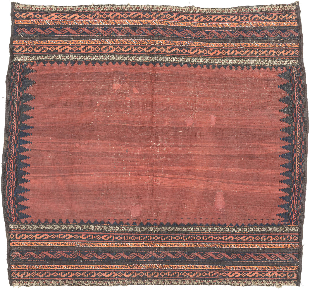 This Baluch sofreh was handwoven during the late 19th century in Afghanistan.

It features an open red abrashed field with a navy sawtoothed perimeter. It is finished on top and bottom with multiple bands of various 