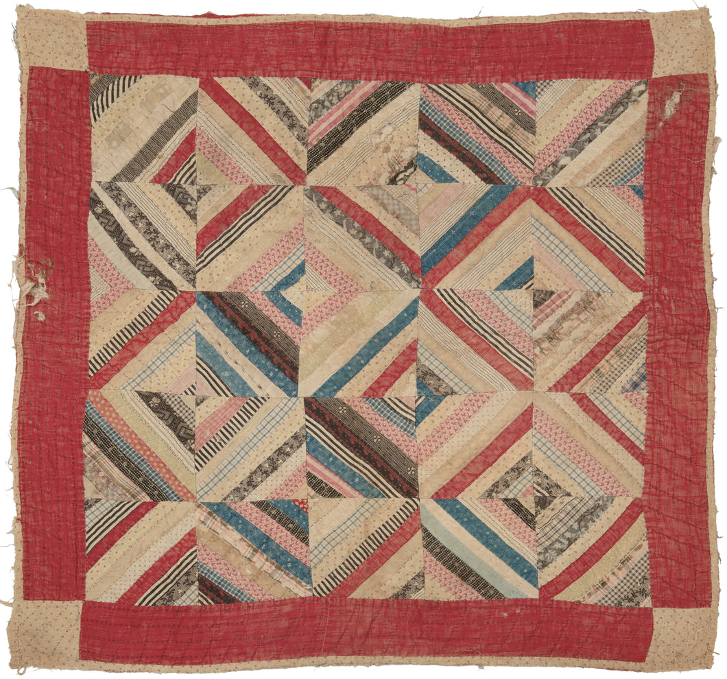 This quilt was hand-sewn in North America during the early 20th century.   It features a variation of the log cabin pattern in various diamond shapes. Framed by a red border.