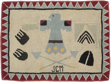 It features a variety of Native American symbols against a cream ground and framed a border of interlocking red and blue triangles that have been perfectly reconciled around the corners. The most prominent motif is a thunderbird which is a symbol of protection, power and strength. To the left are what appear to be bear paw prints (protection, power and strength) and to the right a Teepee (connection to nature and the ancestors) and a deer hoof (strength, agility and grace). 