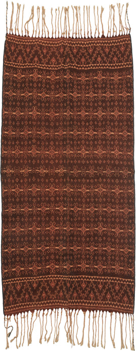 Ende was an important trading post where many cloths were traded including Indian Patola. This cloth is highly influenced by Patola and was created using traditional ikat techniques. A tightly rendered repeat pattern is executed in cotton dyed with indigo and morinda with the cream tinged with morinda from the resist process. A semba is a traditional man's shawl of the indigenous Sikka people of Flores.