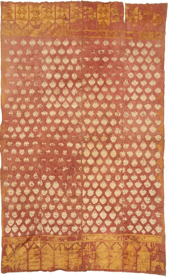 19th century Phulkari is a tradition of folk embroidery from the Punjab region that encompasses both India and Pakistan. This Phulkari was crafted in four strips and composed  of ivory and gold silken thread atop terracotta dyed cotton.