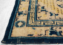 Ningxia Rug circa 1800 composed of a central mandala flanked by four smaller medallions over an intricate diamond lattice repeat. With a classic Ningxia palette that includes two shades of blue, brown, ivory, mauve and a desirable imperial yellow ground.&nbsp;The main border design features floral motifs on a mauve ground. The inner minor borders features a Greek key motif and the outer perimeter border features bands of both blue tones.