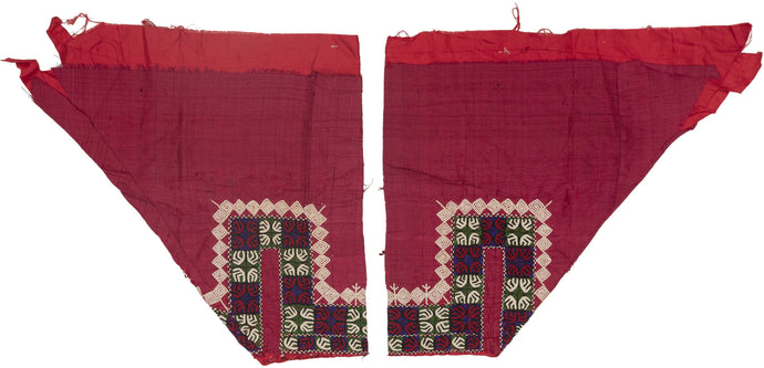 These trouser cuffs were handmade in Turkmenistan during the 20th Century.   Turkmen women traditionally wear colorful ankle length dresses with baggy trousers in contrasting color and decorated bands. These trousers feature wonderful detailed embroidery bands near the ankles in blue, red, green and ivory on a magenta cloth.