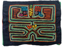 Vintage Mola cloth handmade by the Guna (previously spelled Kuna) people of the San Blas Islands.  Mola is a reverse appliqué technique, similar to the technique used in quilting but&nbsp;using multiple layers of different-colored cloth that are first sewn together before a design is created by cutting away different layers. These cloths are traditionally made in pairs to be worn on the front and back of women's blouses.  This Mola features colorful abstracted bird head forms.