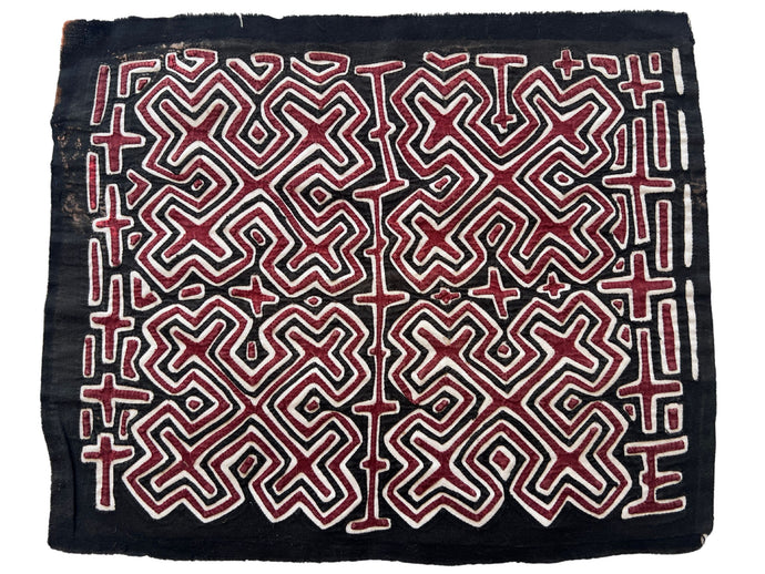 Vintage Mola cloth handmade by the Guna (previously spelled Kuna) people of the San Blas Islands.  Mola is a reverse appliqué technique, similar to the technique used in quilting but using multiple layers of different-colored cloth that are first sewn together before a design is created by cutting away different layers. These cloths are traditionally made in pairs to be worn on the front and back of women's blouses.  This Mola features four quadrants each with a large 