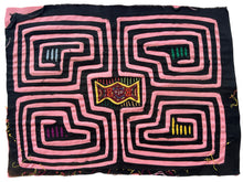 Vintage Mola cloth handmade by the Guna (previously spelled Kuna) people of the San Blas Islands.  Mola is a reverse appliqué technique, similar to the technique used in quilting but&nbsp;using multiple layers of different-colored cloth that are first sewn together before a design is created by cutting away different layers. These cloths are traditionally made in pairs to be worn on the front and back of women's blouses.  This Mola features a maze like pattern with a face in the center. 