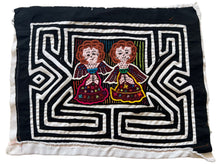 Vintage Mola cloth handmade by the Guna (previously spelled Kuna) people of the San Blas Islands.  Mola is a reverse appliqué technique, similar to the technique used in quilting but using multiple layers of different-colored cloth that are first sewn together before a design is created by cutting away different layers. These cloths are traditionally made in pairs to be worn on the front and back of women's blouses.  This Mola features two angels. 