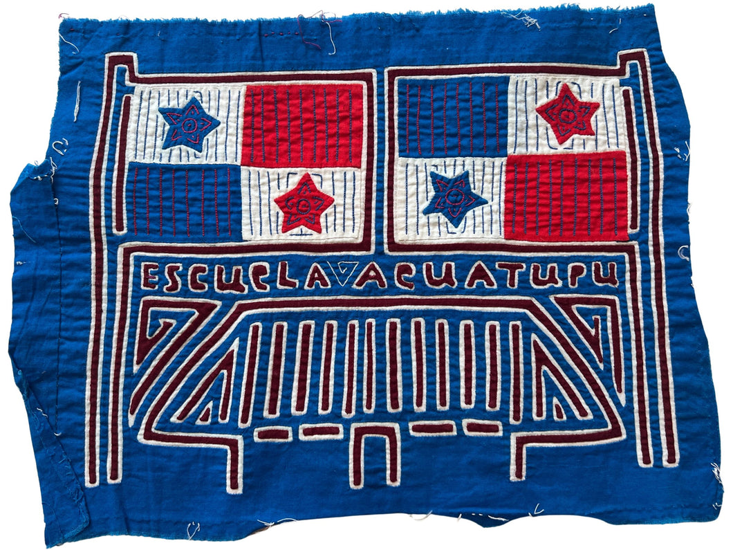 Vintage Mola cloth handmade by the Guna (previously spelled Kuna) people of the San Blas Islands.  Mola is a reverse appliqué technique, similar to the technique used in quilting but using multiple layers of different-colored cloth that are first sewn together before a design is created by cutting away different layers. These cloths are traditionally made in pairs to be worn on the front and back of women's blouses.  This Mola mentions Escuela Acuatupu and features two Panamanian flags. 