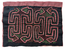 Vintage Mola cloth handmade by the Guna (previously spelled Kuna) people of the San Blas Islands.  Mola is a reverse appliqué technique, similar to the technique used in quilting but&nbsp;using multiple layers of different-colored cloth that are first sewn together before a design is created by cutting away different layers. These cloths are traditionally made in pairs to be worn on the front and back of women's blouses.  This Mola features a pattern of abstracted snakes. 