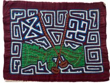 Vintage Mola cloth handmade by the Guna (previously spelled Kuna) people of the San Blas Islands.  Mola is a reverse appliqué technique, similar to the technique used in quilting but&nbsp;using multiple layers of different-colored cloth that are first sewn together before a design is created by cutting away different layers. These cloths are traditionally made in pairs to be worn on the front and back of women's blouses.  This Mola features a map of Panama