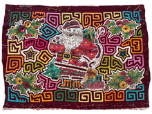 Vintage Mola cloth handmade by the Guna (previously spelled Kuna) people of the San Blas Islands.  Mola is a reverse appliqué technique, similar to the technique used in quilting but&nbsp;using multiple layers of different-colored cloth that are first sewn together before a design is created by cutting away different layers. These cloths are traditionally made in pairs to be worn on the front and back of women's blouses.  This Mola features a pattern of Santa Claus.  The fabric is in very good condition.