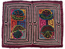 Vintage Mola cloth handmade by the Guna (previously spelled Kuna) people of the San Blas Islands.  Mola is a reverse appliqué technique, similar to the technique used in quilting but&nbsp;using multiple layers of different-colored cloth that are first sewn together before a design is created by cutting away different layers. These cloths are traditionally made in pairs to be worn on the front and back of women's blouses.  This Mola features two pair of of double headed flowers. 