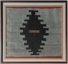 This&nbsp;Navajo rug was woven in the&nbsp;Southwest United States during the 2nd quarter of the 20th Century.

The design is composed of a single black sawtoothed diamond on a heathered gray field. A central sand toned dash and thin blocks of red on the top and bottom add visual interest and dimension. Straightforward yet very moving with a powerful presence. A nice showcase and celebration of Navajo weaving.