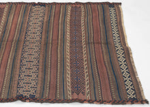 It is composed of various bands of graphic and well-contrasted geometric patterns that utilize a simple but effective palette which is reflective of classic Baluch aesthetics. The bands alternate between plain kilim weave and a carefully executed weft float technique that lends texture and depth to the piece enhancing its visual interest.&nbsp;