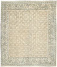 This rug features an all-over design of interconnected soft mauve latticework outlined in powder blue on a cream ground. The main border is a wonderful alternating pomegranate motif and the perimeter border features abstracted cloudbands. A perfect showcase of classic Khotan patterning which is a wonderful hybrid of both Central and Eastern Asian design.&nbsp;