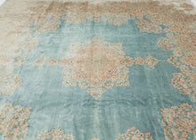 This Kerman rug handwoven during the second quarter of the 20th century.


It features a central medallion floating above an open turquoise ground and framed by a large and elegant border. The medallion and border are both composed of beautifully detailed floral sprays in pastel pinks, reds, seafoam green, copper, and gold and khaki.&nbsp;