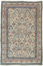 This Sarouk was handwoven during the middle of the 20th century.

The composition is composed of various weeping willows and floral bouquets in a pleasing palette of blues, reds and pinks on a pale yellow ground. This patterning is uncharacteristic of Sarouk weaving and more commonly associated with Kashan. Nicely framed by a distinctive red and yellow dual ground interlock border.