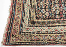 Quchan KURD It features a fine and densely woven lattice of repeating floral motifs in various blues, red, yellow, green, peach, brown and ivory set against an indigo ground. The interconnected patterning and consistent use of color and spacing create a mesmerizing rhythm. Nicely framed by a series of larger borders of shapes and rosettes and thinner simple candy cane stripes in an array of tones
