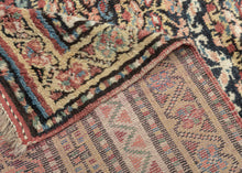 Quchan KURD It features a fine and densely woven lattice of repeating floral motifs in various blues, red, yellow, green, peach, brown and ivory set against an indigo ground. The interconnected patterning and consistent use of color and spacing create a mesmerizing rhythm. Nicely framed by a series of larger borders of shapes and rosettes and thinner simple candy cane stripes in an array of tones