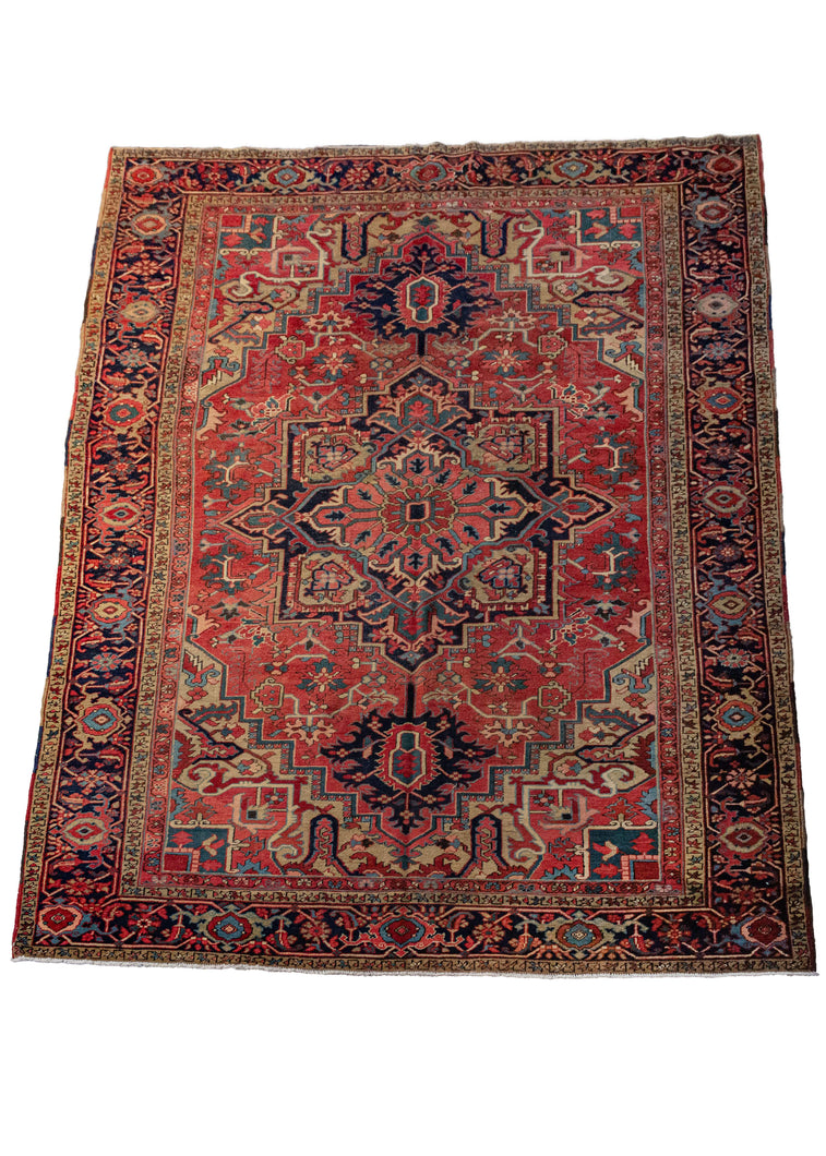 Antique NW Persian Heriz Central Medallion room size rug featuring pinks and greens and strong contrast