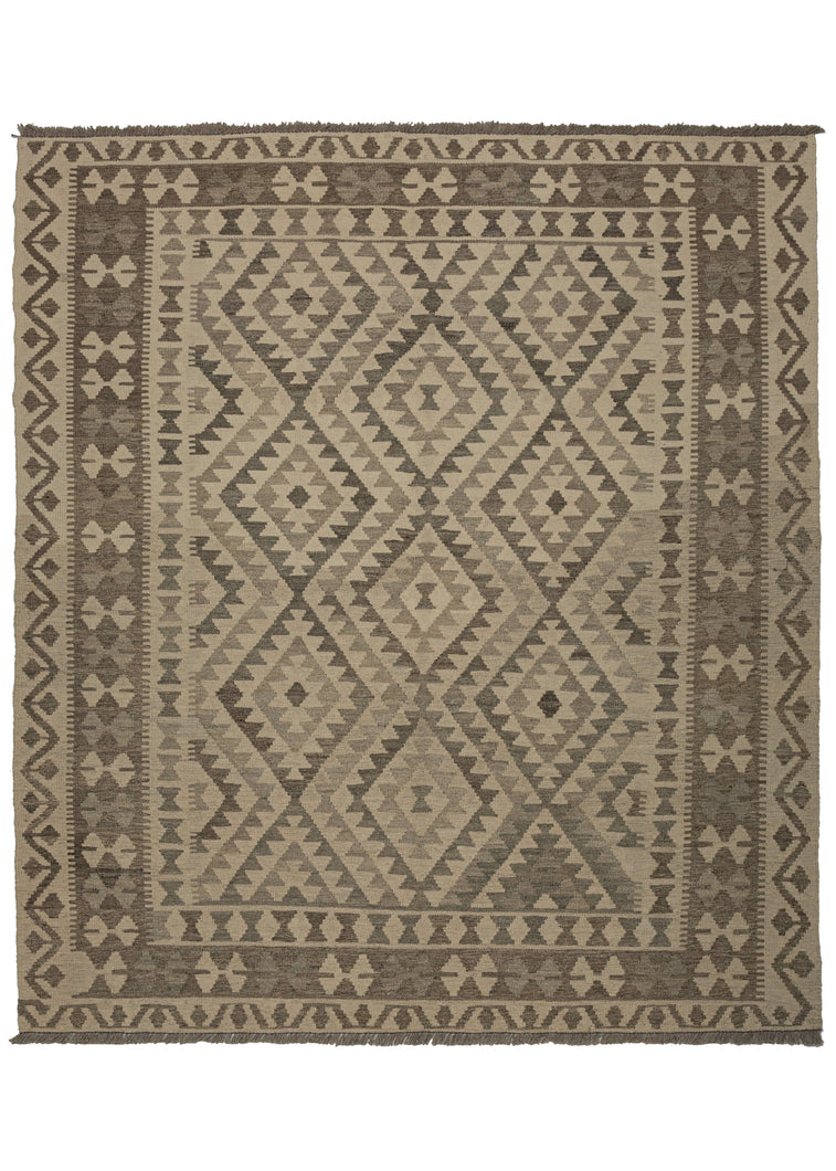 This Contemporary Maimana kilim was woven in Afghanistan during the 21st Century.  It features classic Maimana patterning of stepped diamonds but in a neutral palette of soft browns, gray, and ivory. A versatile piece with a calming presence.  In excellent condition, flat-woven with a substantial handle.