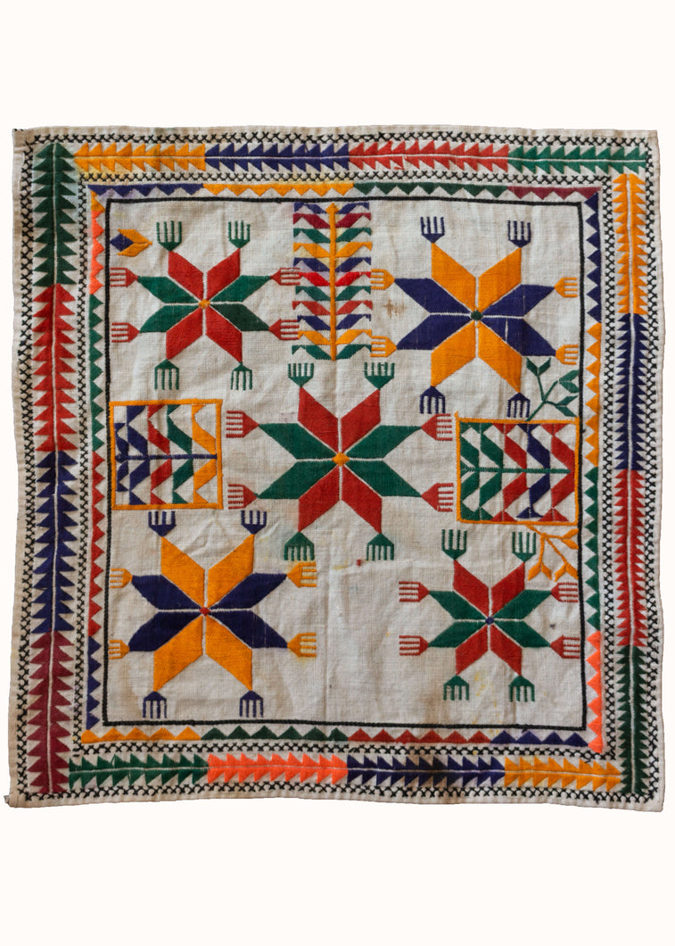 Vintage Hand Embroidered Afghani Pakistani Hazara Prayer Cloth with bright orange green and red colored stars and hands