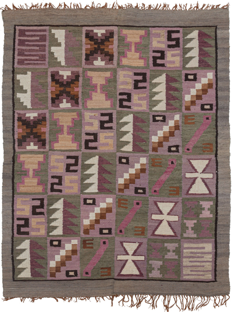 This Vintage Peruvian Kilim features a grid of diagonally repeating squares full of various abstracted shapes and symbols. It is woven in two panels which are sewn together and utilize tones of soft cochineal purples, undyed browns, and greens with pops of yellow. The colors and style suggest it was woven by the talented weavers in the Ayacucho region. Very soft and lightweight, can double as a multifunctional textile or wall tapestry.