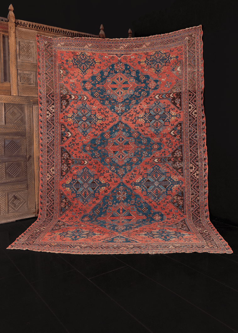 early 20th century caucasian soumak rug with lesghi star design in blue on pink field in great condition