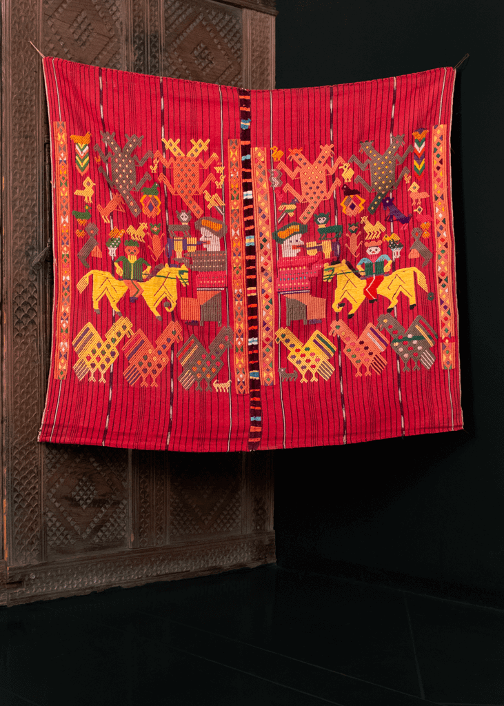 Textile crafted on a backstrap loom near Nahuala, Guatemala during 20th century. Called a tzute meaning a multifunctional cloth used to wrap or carry things on a person's head. Interesting design of shapes, animals and figures. 