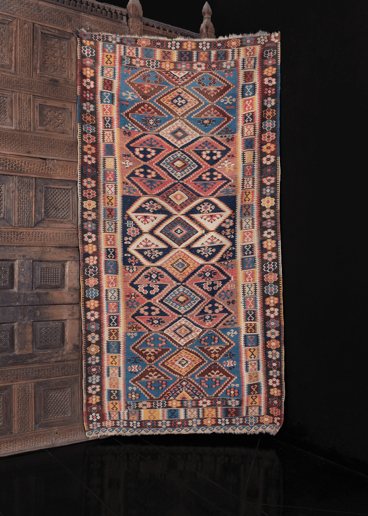 geometric anatolian erzurum kilim from early 20th century with multicolor rainbow geometric design and unusual rosette border