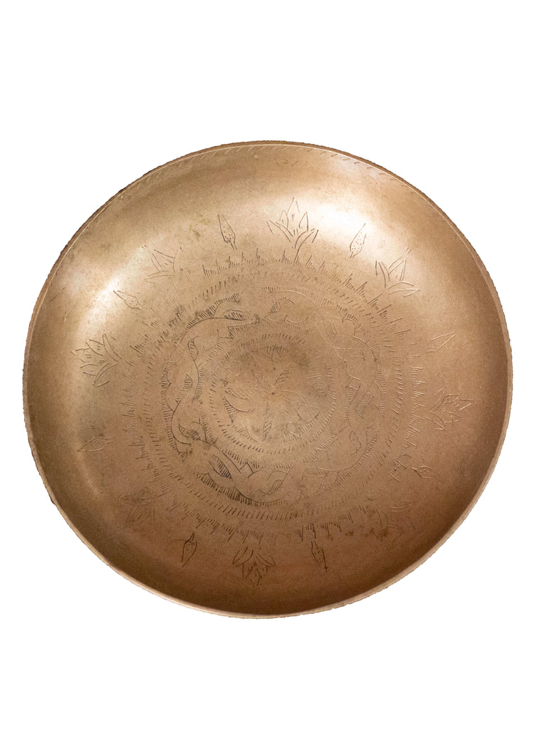 Hand-etched brass bowl from Swat Valley with a delicate circular design. 